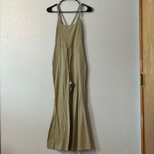 light green flared jumper with a middle crossed back. size M. never worn.
